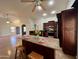 Bright, open kitchen featuring a granite island, and a full view into the open concept living areas at 3284 E Sandy Way, Gilbert, AZ 85297