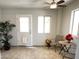 Inviting sunroom featuring tile flooring, ceiling fan, and natural light streaming through windows at 3284 E Sandy Way, Gilbert, AZ 85297