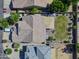 A bird's-eye view reveals a beautiful yard, covered patio, and well-maintained landscaping at 34942 N Camp Fire Cir, San Tan Valley, AZ 85144