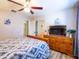 Bedroom featuring ceiling fan, wood dresser, and neutral color palette at 34942 N Camp Fire Cir, San Tan Valley, AZ 85144