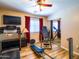 Bedroom featuring fitness equipment, closet with mirrored doors, and laminate flooring at 34942 N Camp Fire Cir, San Tan Valley, AZ 85144