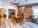 Dining room featuring a wood accent wall and dining table; open to the living room at 34942 N Camp Fire Cir, San Tan Valley, AZ 85144