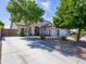Charming single-Gathering home featuring a three-car garage and desert landscaping for low maintenance appeal at 34942 N Camp Fire Cir, San Tan Valley, AZ 85144