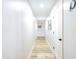 Bright hallway with neutral walls and wood-look flooring at 34942 N Camp Fire Cir, San Tan Valley, AZ 85144