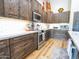 Kitchen with wood cabinets, stainless steel appliances, and white countertops at 34942 N Camp Fire Cir, San Tan Valley, AZ 85144