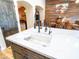 Kitchen island with a farmhouse sink and a view of the dining room at 34942 N Camp Fire Cir, San Tan Valley, AZ 85144