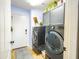 Laundry room featuring front load washer/dryer and storage cabinets at 34942 N Camp Fire Cir, San Tan Valley, AZ 85144