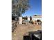 Backyard with dirt and an assortment of discarded and stored items at 3556 E Helena Dr, Phoenix, AZ 85032