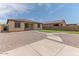 Backyard featuring artificial grass, stepping stones, gravel and block wall at 4150 S Neutron --, Mesa, AZ 85212