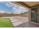 Backyard featuring artificial grass, a patio, stepping stones, gravel and block wall at 4150 S Neutron --, Mesa, AZ 85212