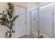 Walk-in shower with glass door and white tile in a well-lit bathroom at 4150 S Neutron --, Mesa, AZ 85212