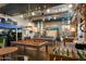 Large game room with pool tables, foosball and bus stop decor creating a fun gathering spot at 4150 S Neutron --, Mesa, AZ 85212