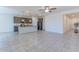 Open-concept layout featuring tile flooring and a modern kitchen island with pendant lights at 4150 S Neutron --, Mesa, AZ 85212