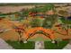 Aerial view of a vibrant community playground with slides, climbing structures, and a soft surface ground at 4150 S Neutron --, Mesa, AZ 85212