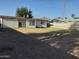 Spacious backyard with a large grassy area, patio, and view of nearby mountain at 4223 E Earll Dr, Phoenix, AZ 85018