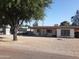 Charming single-story home with a well-maintained front yard, mature tree and covered front porch at 4223 E Earll Dr, Phoenix, AZ 85018