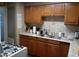 Functional kitchen features wood cabinets, laminate countertops, and stainless steel double sink at 4223 E Earll Dr, Phoenix, AZ 85018