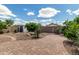 Serene backyard featuring a paver patio, gravel landscaping, and a storage shed, perfect for outdoor enjoyment at 4321 E Rowel Rd, Phoenix, AZ 85050