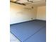 Garage featuring a painted floor, and convenient storage shelves at 4321 E Rowel Rd, Phoenix, AZ 85050