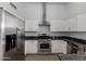 Well-equipped kitchen with stainless steel appliances, granite countertops, and plenty of storage at 4321 E Rowel Rd, Phoenix, AZ 85050