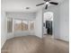 Spacious main bedroom with wood-look floors, lots of windows, and an en-suite bathroom at 4321 E Rowel Rd, Phoenix, AZ 85050