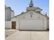 Attached two-car garage with desert landscaping and gated side entry at 440 N New Hvn, Mesa, AZ 85205