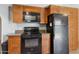 Well-lit kitchen featuring a microwave and granite countertops at 440 N New Hvn, Mesa, AZ 85205