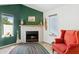Cozy living room highlighting a painted brick fireplace and natural light at 440 N New Hvn, Mesa, AZ 85205