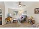 Cozy living room features a ceiling fan and a window letting in natural light at 440 N New Hvn, Mesa, AZ 85205