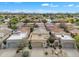 Aerial view of desert community with tree-lined streets and mountain views at 4545 E Wescott Dr, Phoenix, AZ 85050