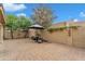 Backyard featuring brick pavers, desert landscaping, and barbecue area for relaxing and entertaining at 4545 E Wescott Dr, Phoenix, AZ 85050