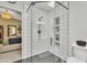 Modern bathroom with white subway tile shower, glass door, and updated fixtures provides a sleek, contemporary space at 4545 E Wescott Dr, Phoenix, AZ 85050