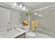 This bright bathroom is well-appointed with modern fixtures, a granite countertop, and a glass-enclosed shower for a clean look at 4545 E Wescott Dr, Phoenix, AZ 85050