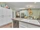 Open kitchen with dishwasher and view to dining room at 4545 E Wescott Dr, Phoenix, AZ 85050
