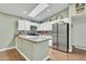 Bright kitchen with stainless steel appliances, grey countertops, and a skylight at 4545 E Wescott Dr, Phoenix, AZ 85050