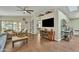 Bright living area boasts hardwood floors, built-in bookshelves, and a serene view to the backyard at 4545 E Wescott Dr, Phoenix, AZ 85050