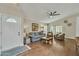 Open living space with hardwood floors, a ceiling fan, and access to the backyard through sliding doors at 4545 E Wescott Dr, Phoenix, AZ 85050