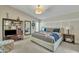 Relaxing bedroom with a tray ceiling, and large windows at 4545 E Wescott Dr, Phoenix, AZ 85050