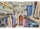 An organized walk-in closet offering ample storage with custom shelving and hanging space for clothing and accessories at 4545 E Wescott Dr, Phoenix, AZ 85050