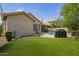 Lush backyard with artificial turf, pool, lounge chairs, and barbecue area, ideal for outdoor living at 4584 W Detroit St, Chandler, AZ 85226