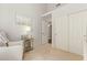 Bedroom with carpet, featuring a mirrored side table, and closet, blending comfort and functionality at 4584 W Detroit St, Chandler, AZ 85226