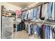 Organized walk-in closet maximizing storage with shelves and rods, offering practical space solutions at 4584 W Detroit St, Chandler, AZ 85226