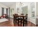 Dining area with hardwood floors, a chandelier, large windows, and a sliding glass door to the patio at 4584 W Detroit St, Chandler, AZ 85226