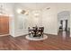Light-filled dining room with wood floors, a chandelier, and views of the living area at 4584 W Detroit St, Chandler, AZ 85226