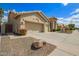 Lovely suburban home showcasing a neatly kept lawn and a convenient three-car garage at 4584 W Detroit St, Chandler, AZ 85226