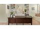 Stylish home office with built-in shelving, a large wooden desk, and sophisticated decor at 4584 W Detroit St, Chandler, AZ 85226