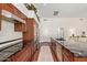 Stylish kitchen featuring stainless steel appliances, granite countertops, and dark wood cabinetry at 4584 W Detroit St, Chandler, AZ 85226