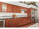 Kitchen with stainless steel appliances, granite countertops, a wine fridge, and ample cabinet space at 4584 W Detroit St, Chandler, AZ 85226