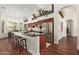 Kitchen featuring a large island with bar seating, stainless steel appliances, and adjacent dining area at 4584 W Detroit St, Chandler, AZ 85226