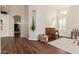 Sunlit living room featuring hardwood floors, elegant archways, and a cozy seating area at 4584 W Detroit St, Chandler, AZ 85226